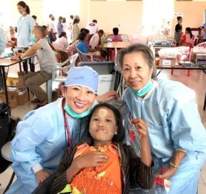 Dr. Yeh, staff member, and a child patient