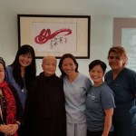 Dr. Yeh and staff members smiling