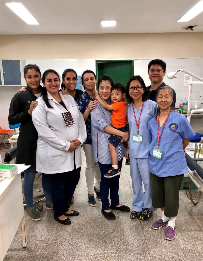 Staff members and Dr. Yeh smiling