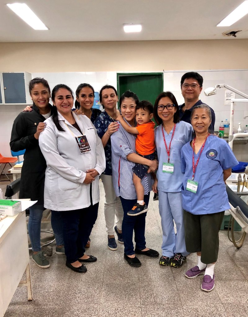 Staff members and Dr. Yeh smiling