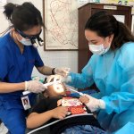 Dr. Yeh doing charity work on a patient