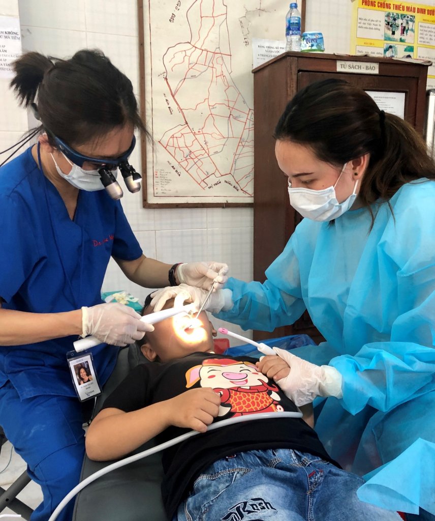 Dr. Yeh doing charity work on a patient