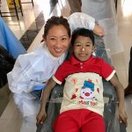 Dr. Yeh with a child patient on her mission trip